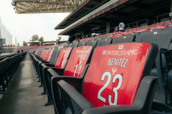 How do UK basketball academies compare to those in the US?